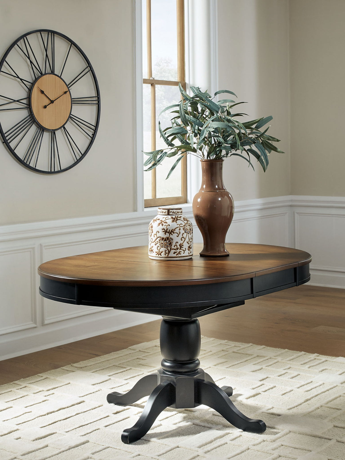 Clorazi - Oval Dining Room Butterfly Extension Table - Black / Brown